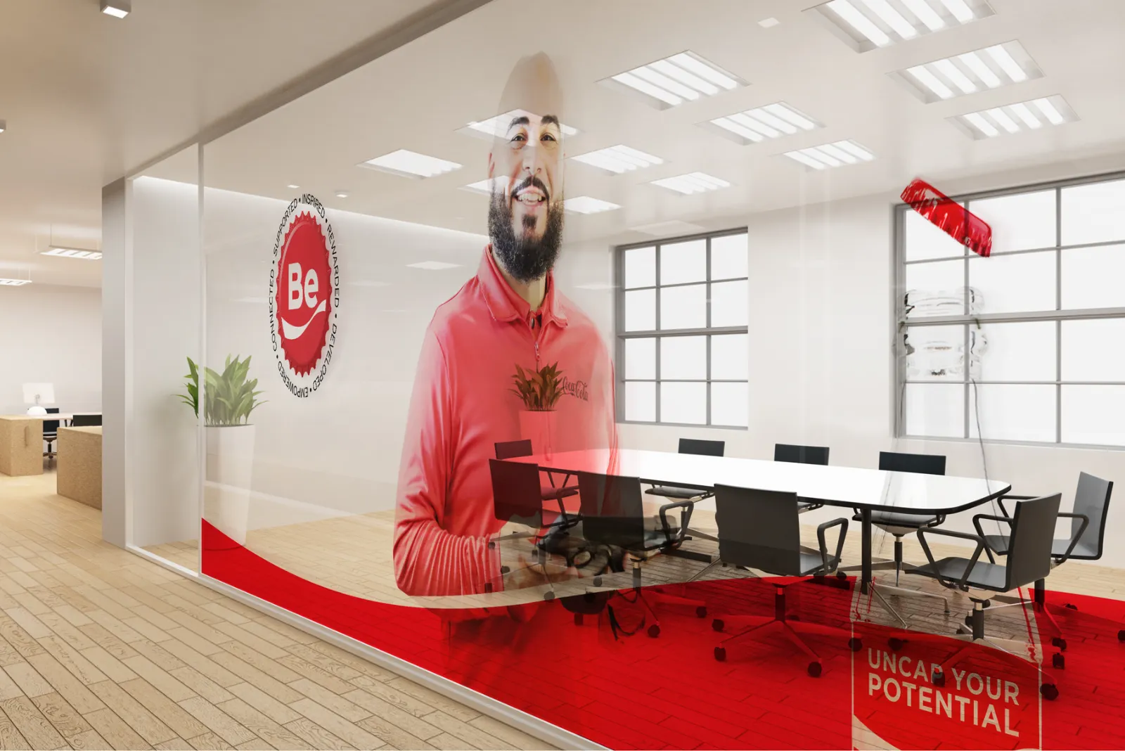 Meeting room with Be program window graphics in Coca-Cola red