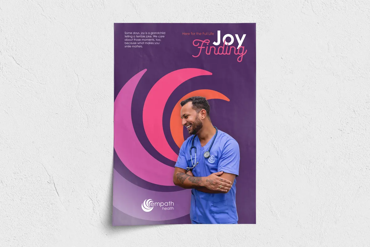 Empath Health poster of a smiling caregiver inside the nautilus spiral, with the line Joy Finding