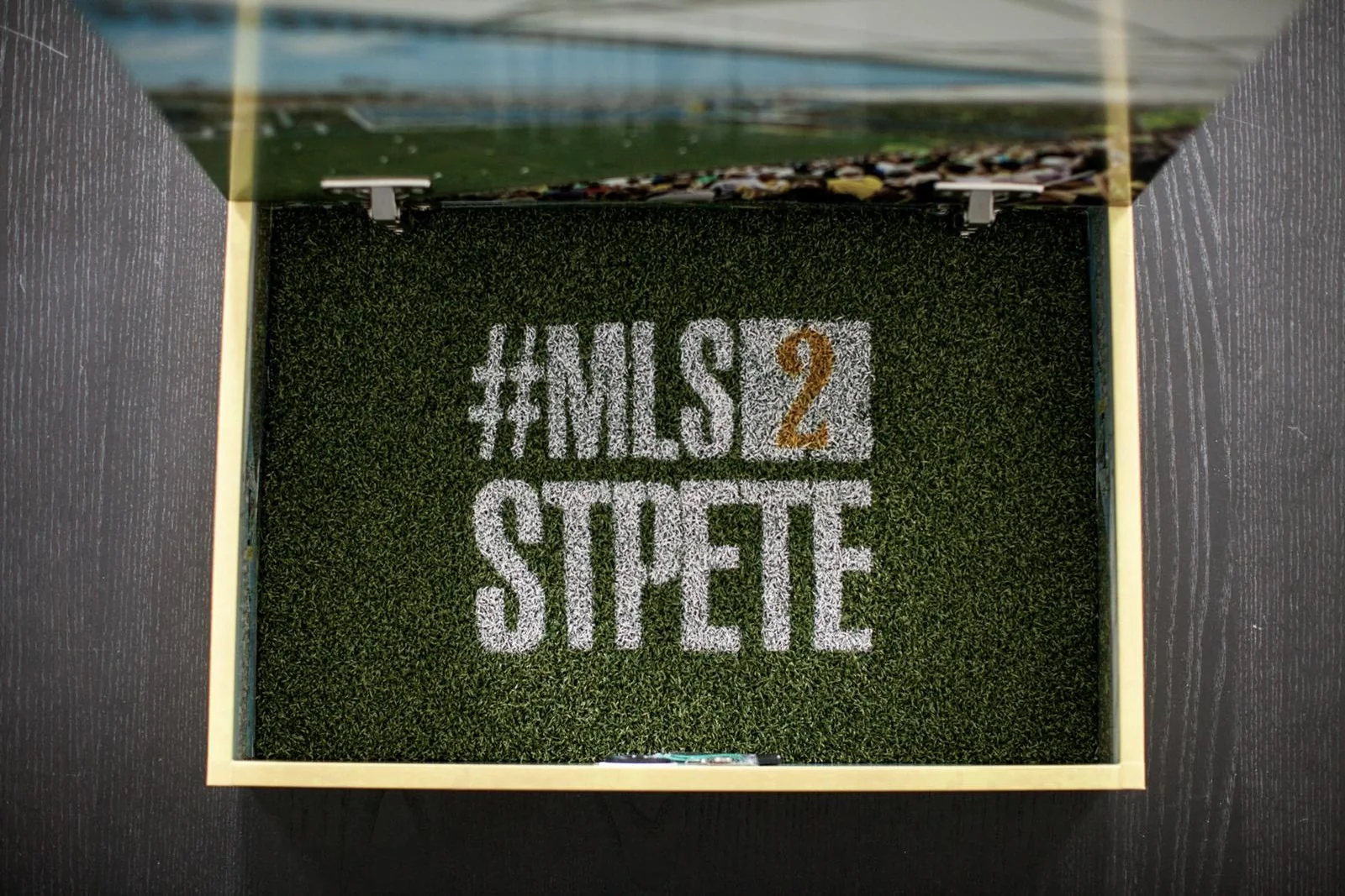 The open box with #MLS2StPete chalked into the turf