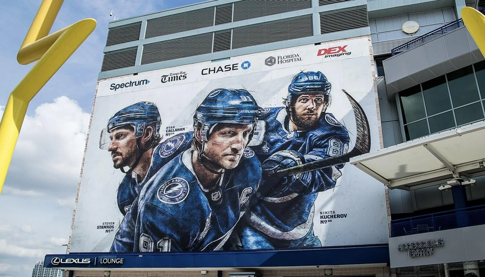 Tampa Bay Lightning 25th season player artwork wrapped on the side of the arena, with Steven Stamkos, Nikita Kucherov and Ryan Callahan